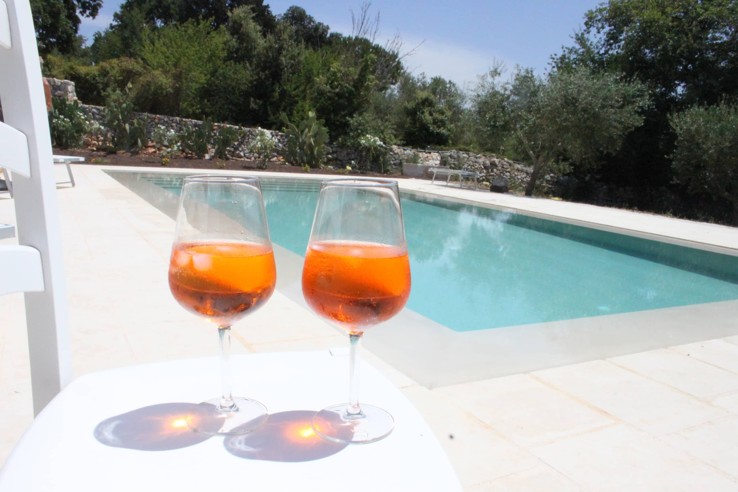 Two spritzes served at the edge of the pool